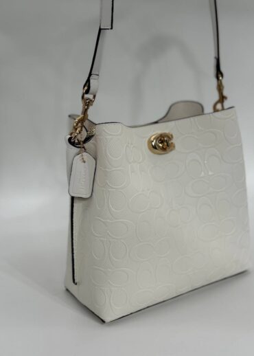 Coach Gofraj baskılı kilitli büzgülü beyaz çanta